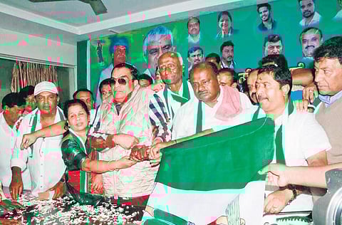 Former chief minister HD Kumaraswamy welcomes Congress leaders into the party at the JDS office in Bengaluru on Sunday | Express