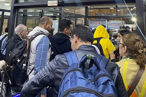 Moroccan fans heading to Qatar to support their team queue up in Casablanca airport after their flights were cancelled, in Casablanca, Morocco, Wednesday, Dec. 14, 2022. (Photo | AP)