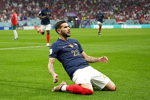 France's Theo Hernandez, center, celebrates after scoring the opening goal during the World Cup semifinal soccer match between France and Morocco. (Photo | AP)