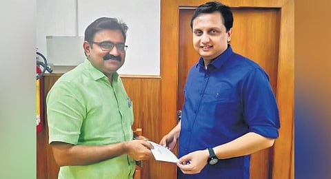 Kochi Mayor M Anilkumar submitting a petition to Works Minister Mohamed Riyas seeking to speed up DPR work for the drainage system on MG Road