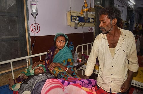 A victim of Saran hooch tragedy being treated in Patna Medical College and Hospital (PMCH), in Patna, Bihar. (Photo | PTI)