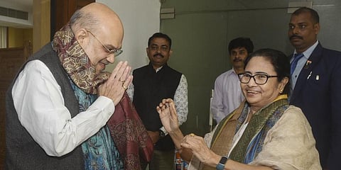 Union Home Minister Amit Shah with West Bengal Chief Mamata Banerjee on the sidelines of the 25th meeting of the Eastern Zonal Council at Nabanna.(Photo | PTI)
