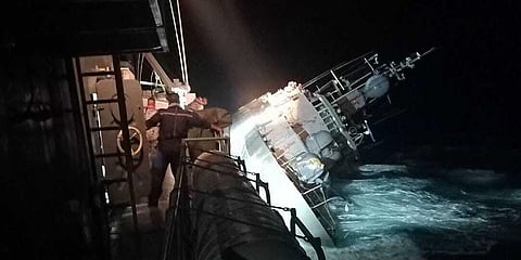 Photo provided by the Royal Thai Navy, the HTMS Sukhothai corvette warship lists off the coast of Prachuap Khiri Khan province, Thailand, Sunday, Dec. 18, 2022.(Photo | AP)