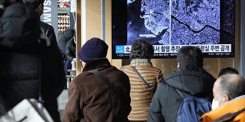TV screen shows images showing a space view of the South Korean capital and Incheon, left, during a news program at the Seoul Railway Station in Seoul, South Korea, Monday, Dec. 19, 2022. (Photo | AP)