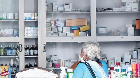 File photo of a woman buying medicines at a pharmacy.
