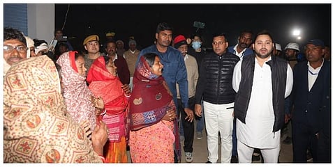 Tejashwi Yadav with fishing community members. (Photo | Tejaswi Yadav Twitter)