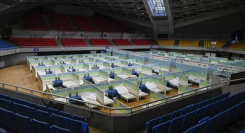 Beds for patients are seen in partitioned rooms at a makeshift fever clinic at a stadium amid the Covid-19 pandemic in Beijing. (Photo | AFP)