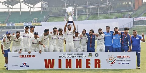 Indian team poses with the trophy after winning the second test match against Bangladesh in Dhaka, Bangladesh, Dec. 25, 2022. (Photo | AP)