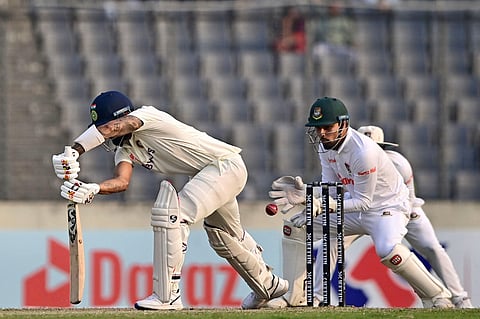 Bangladesh’s Nurul Hasan (C) takes a catch to dismiss India’s KL Rahul (L) during the third day of the second cricket Test match between Bangladesh and India in Dhaka. (Photo | AFP)