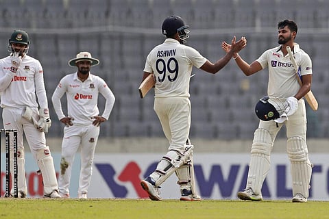 India's Ravichandran Ashwin, left, and Shreyas Iyer celebrate their team victory during the fourth day of the second cricket test match between Bangladesh and India, in Dhaka (Photo | AP)