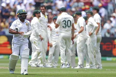 South Africa's Temba Bavuma walks from the field after he was dismissed by Australia's Mitchell Starc during the second test at the Melbourne Cricket Ground, Dec. 26, 2022. (Photo | AP)