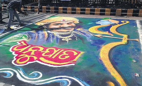 A rangoli drawn on the road in front of Bargarh Women’s College | Express