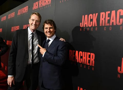 British author Lee Child (L) is pictured in 2016 with US actor Tom Cruise who played the title character in two Jack Reacher movies. (Photo | AFP)