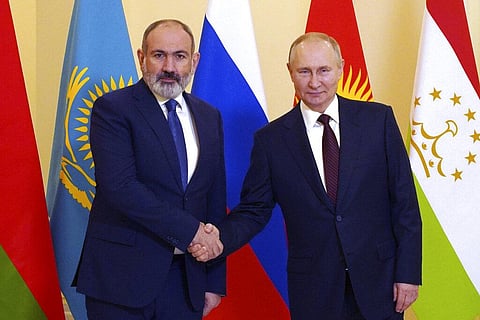 Russian President Vladimir Putin, right, and Armenian Prime Minister Nikol Pashinyan shake hands ahead of an informal meeting. (Photo | AP)
