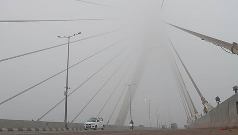 A scene of Signature bridge where fog covered the whole area, in New Delhi. (Photo | Shekhar Yadav, EPS)