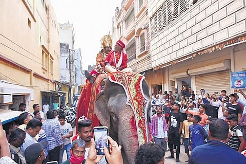 King Kansa riding an elephant through a street in Bargarh town | Express