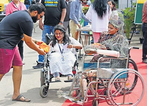 Specially-abled persons at an event held to mark International Day of Persons with Disabilities in Lalbagh on Friday. (Photo | Vinod Kumar T)