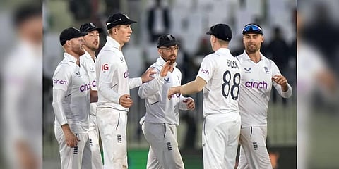 England's Jacks Leach, center, and teammates shake hands on the end of the third day play of the first test cricket match between Pakistan and England, in Rawalpindi, Pakistan | PTI