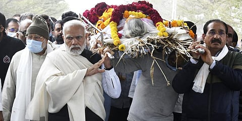 Prime Minister Narendra Modi carries the mortal remains of his mother Heeraben Modi, who passed away at the age of 100, in Gandhinagar, on December 30, 2022. (Photo | PTI)