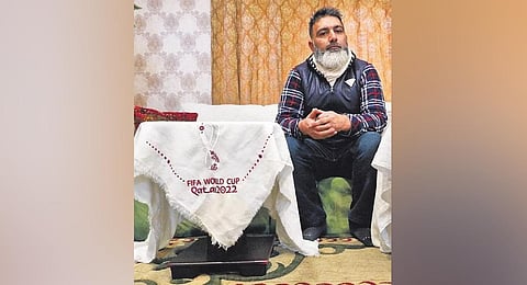 Wasim Rifat with samples of the Pashmina shawls he manufactured for Qatar