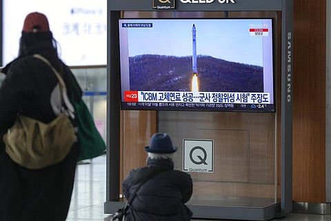 A TV screen shows a file image of North Korea's rocket with the test satellite during a news program at the Seoul Railway Station in Seoul, South Korea, Saturday, Dec. 31, 2022. (Photo | AP)