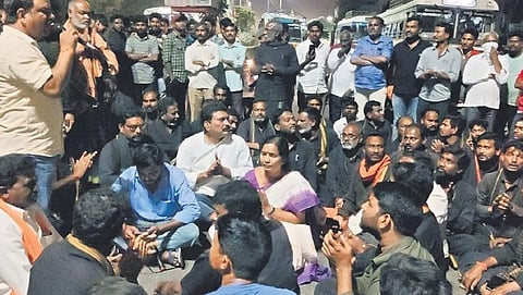 The devotees of Ayyappa and BJP leaders stage a protest near the RIMS Medical College in Adilabad on Friday, demanding that Bairi Naresh be booked under PD Act