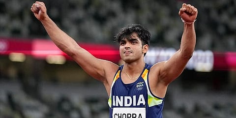 Neeraj Chopra, of India, celebrates after winning the gold medal in the men's javelin throw final at the 2020 Summer Olympics, Saturday, Aug. 7, 2021, in Tokyo. (Photo | AP)