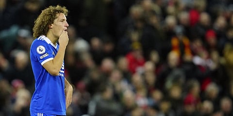 Leicester's Wout Faes reacts after scores an own goal past his goalkeeper during the English Premier League soccer match between Liverpool and Leicester City at Anfield.(Photo | AFP)