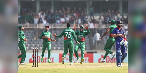 Bangladesh's Mehidy Hasan Miraz, second left and Shakib Al Hasan, center, celebrate wicket of India's Captain Rohit Sharma in Dhaka, Bangladesh on Dec.4, 2022 | PTI