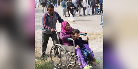 A woman leaves out after casting her vote for the Municipal Corporation of Delhi (MCD) elections. (Photo | PTI)