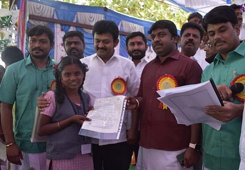 Thalli MLA T Ramachandran distributed birth certificates to 203 children of Bettamugilalam panchayat at an event held in Siddhapuram tribal village on Saturday. (Photo | EPS)