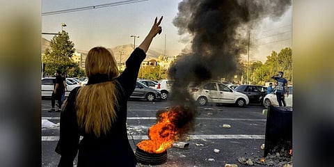 Iranians protests the death of 22-year-old Mahsa Amini after she was detained by the morality police, in Tehran on Oct. 1, 2022 (Photo | AP)