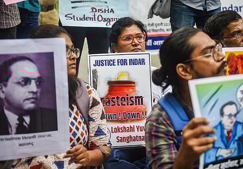 Representational Image: Activists hold placards during a protest demanding justice for a Dalit boy from Rajasthan who died after he was beaten up by his teacher. (Photo | PTI)
