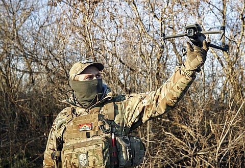 A Ukrainian serviceman flies a drone during an operation against Russian positions at an undisclosed location in the Donetsk region, Ukraine | AP