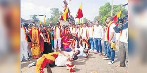 KRV activists perform ‘urulu seve’ at Rani Chennamma Circle in Belagavi on Monday against the proposed visit to the city by two Maharashtra ministers | Express