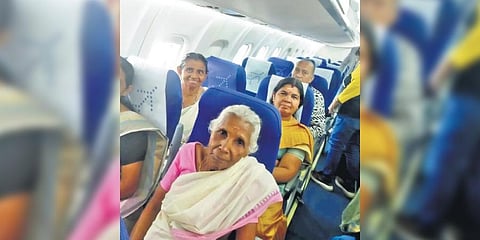84-year-old Satheeretnam and other Kudumbashree members inside the IndiGo plane | Express