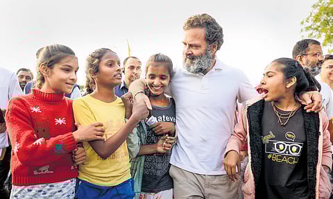 Congress leader Rahul Gandhi with young supporters during the party’s ‘Bharat Jodo Yatra’ at Jhalawar district in Rajasthan on Monday. (Photo | PTI)