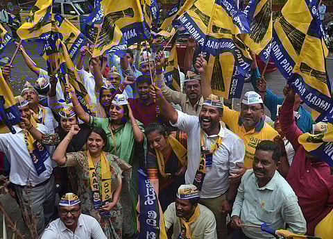 AAP members celebrate in the party office in Bengaluru on Wednesday, after winning the municipality election in Delhi. (Photo | Shashidhar Byrappa, EPS)