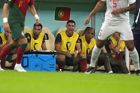 Cristiano Ronaldo, third from right, sits on the bench during the World Cup round of 16 fixture between Portugal and Switzerland, at the Lusail Stadium in Lusail, Dec. 6, 2022. (Photo | AP)