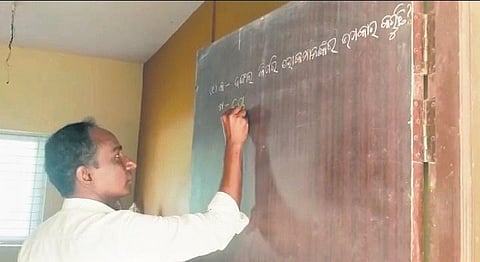 (Left) Video grab of a teacher writing the questions on the classroom door and Hingula government high school in Dharmasala block | Express