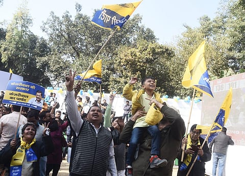 AAP workers dance and celebrate at the party office in Delhi. (Photo | Parveen Negi, EPS)
