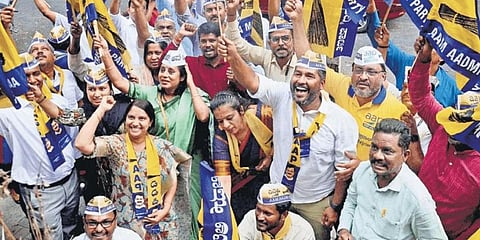 AAP members celebrate the party’s victory in the Municipal Corporation of Delhi elections, at the party office in Bengaluru on Wednesday | Shashidhar Byrappa