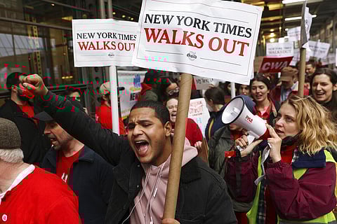 Hundreds of New York Times journalists and other staff picket outside the Times' office after walking off the job for 24 hours. (Photo | AP)