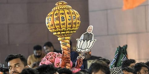 BJP workers celebrating the party's decisive lead in Gujarat Assembly elections, in Gandhinagar. (Photo | PTI)