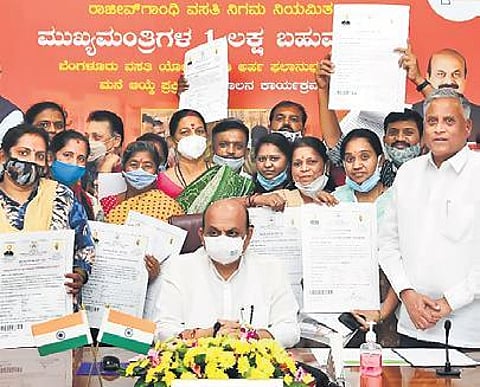 CM Basavaraj Bommai launches the housing scheme for beneficiaries in Bengaluru on Monday, as Housing Minister V Somanna looks on | Express