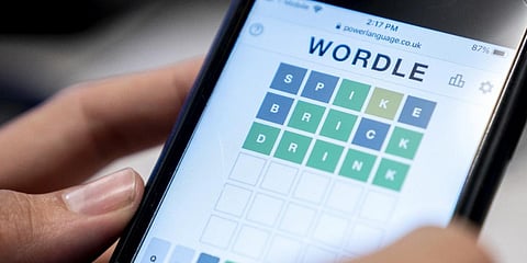 A person playing online word game 'Wordle' on a mobile phone in Washington DC. (File photo| AFP)