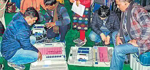 Polling officials check EVMs in Meerut on Wednesday | PTI