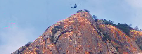 An Air Force helicopter airlifting Babu from Kurumbachi hills to the BEML helipad in Kanjikode
