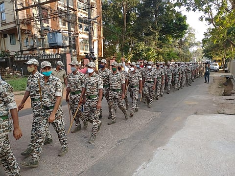 Rapid Action Force (RAF) staff holding a route march in Udupi on Friday (Photo | Express)
