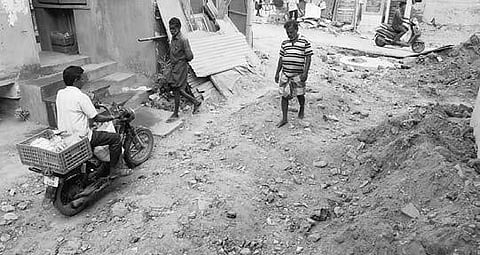 A damaged road in CDN Nagar, Nerkundram | R Satish Babu